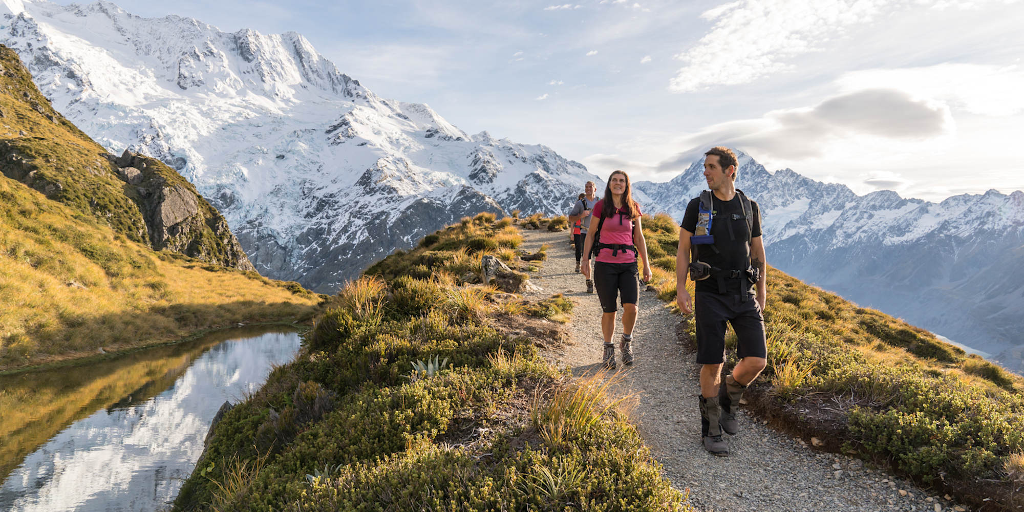 Active Adventures Guide leading the way on a hiking trail in Aoraki Mt Cook National Park New Zealand
